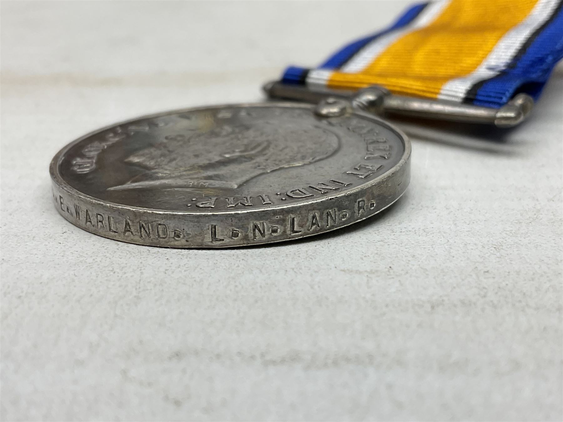 Two WW1 pairs of medals comprising British War Medal and Victory Medal awarded to 24506 Pte. A.E. Warland L.N. Lan. R.; and 1914-15 Star and Victory Medal to 12803 Cpl. J. Evans Devon R.; all with ribbons (4)