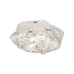 Mid 20th century silver bowl, of hexagonal form with scrolling pierced sides, upon three bun feet, hallmarked W I Broadway & Co, Birmingham 1962, W18cm