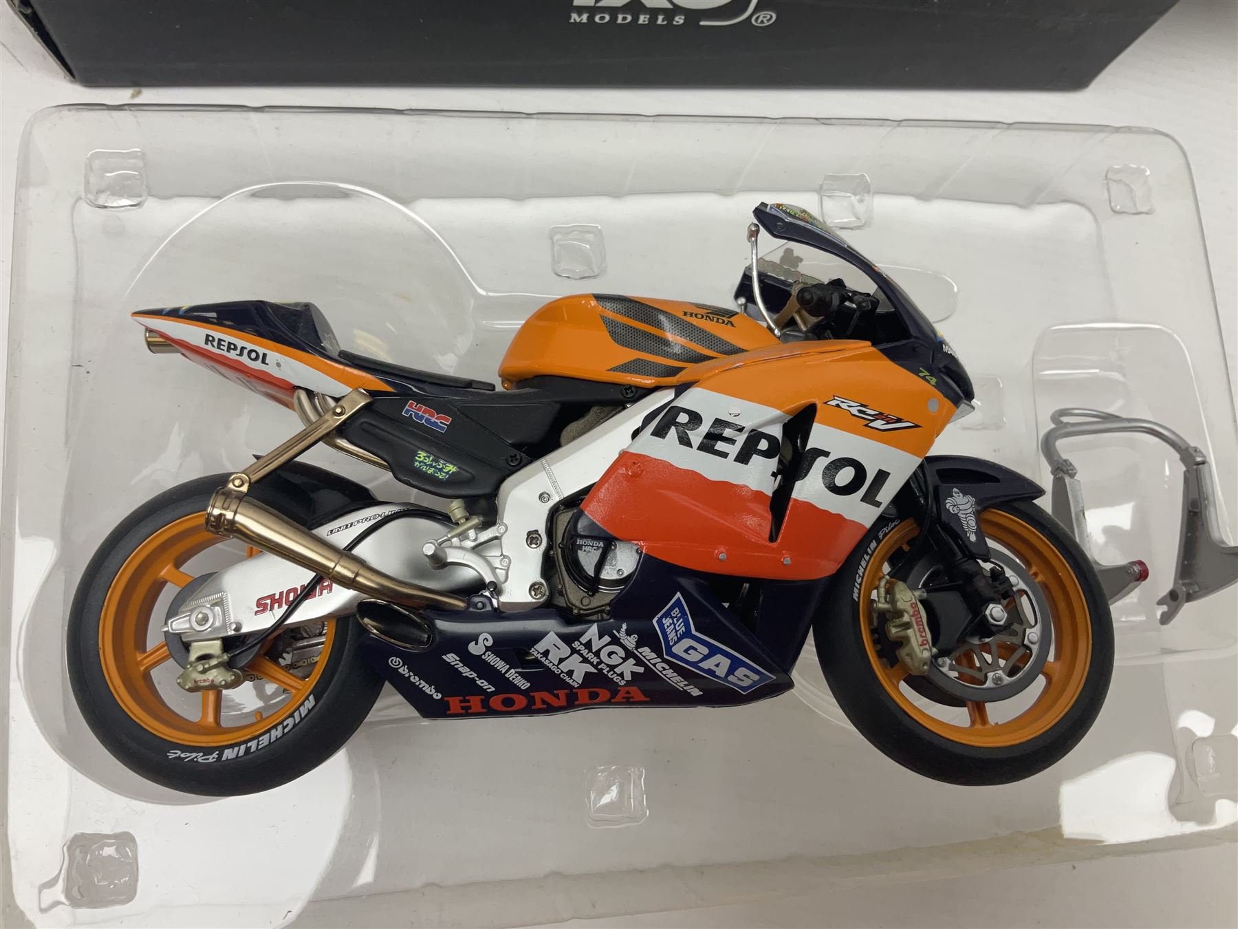 Three Ixo Models 1:12 scale die-cast models of motorcycles - BRB007 Honda NSR500 Michael Doohan 1998; BRB001 Honda RC211V Valentino Rossi 2003; and Yamaha YZR-M1 Colin Edwards MotoGP Phillip Island 2007; all boxed (3)