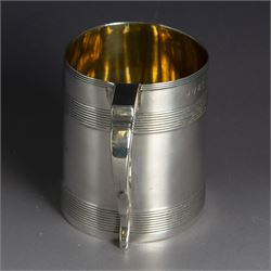 George III silver christening mug, of cylindrical tapering form, with banded decoration and scroll handle, the body with later presentation engraving, hallmarked London 1799, maker's mark worn and indistinct, H8cm
