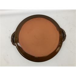 Studio pottery circular tray in brown glaze with cream decoration, with twisted rope detail twin handles, impressed mark beneath, W46cm