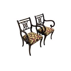 Regency design mahogany twin pedestal dining table, rectangular top with reeded edge, acanthus carved turned column terminating in reeded tripod base with hairy paw feet and castors (W172cm D92cm H75cm) and set eight (6+2) Regency design mahogany dining chairs, pierced back with scroll design, seat upholstered in patterned laurel green fabric, raised on reeded sabre supports (W48cm H88cm)