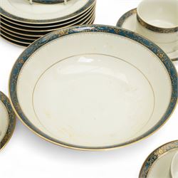 Japanese tea and dinner service retailed by Gazzaz, decorated with blue boarders and heightened with gilt foliate motifs, comprising eight teacups, eight saucers, coffee pot, sucrier, milk jug, eight cake plates, eight soup bowls, eight dinner plates etc