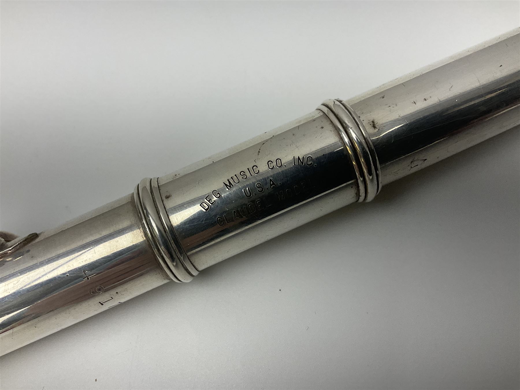 Boosey & Hawkes London Regent three-piece flute, serial no.345447; in B&H Bandhite hard carrying case; and Deg Music Company Inc. USA Claudel Model three-piece flute, serial no.491718, in hard carrying case (2)