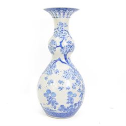 Japanese Meiji period porcelain double gourde vase, painted in blue with birds perched on ...