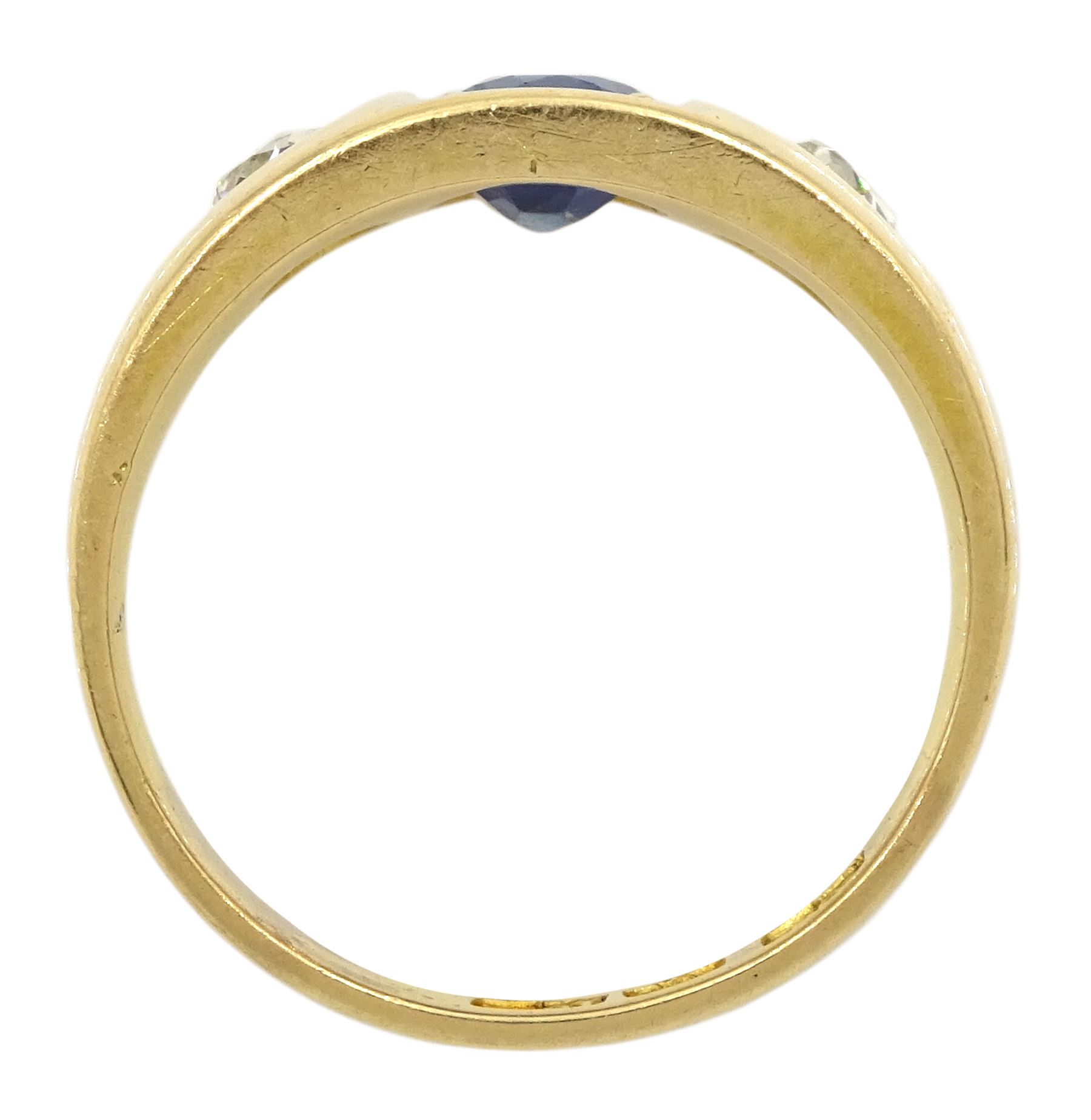 Late 19th century continental gypsy set three stone oval sapphire and old cut diamond ring, stamped 18ct, makers mark HA, total diamond weight approx 0.45 carat, sapphire approx 1.05 carat