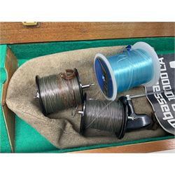Four Abu fishing reels, comprising Ambassadeur 9000, Ambassadeur 7000, Ambassadeur 5500 and Ambassadeur 6500, together with additional line, hardy fishing bag and two wooden boxes