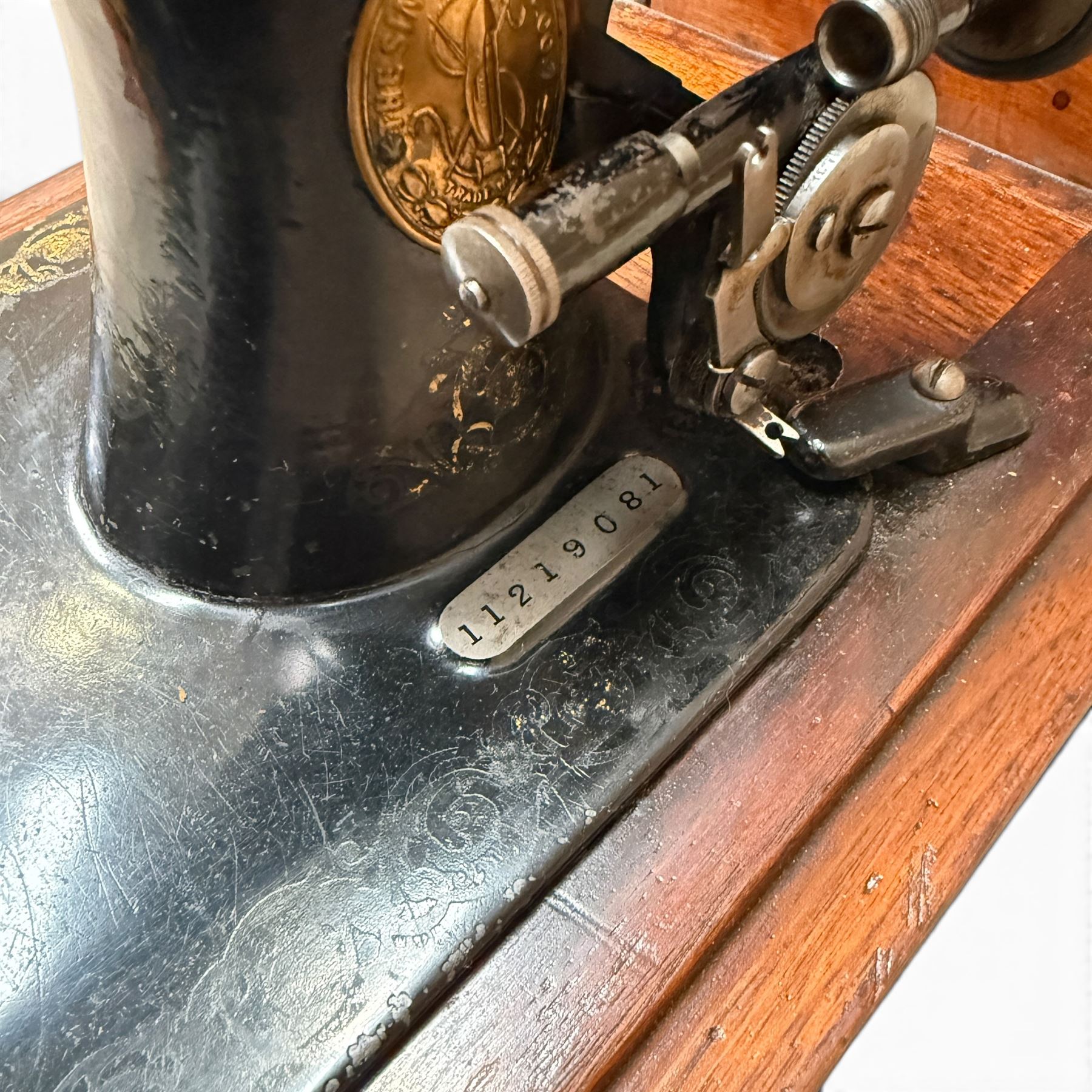 Three Singer wooden cased sewing machines 