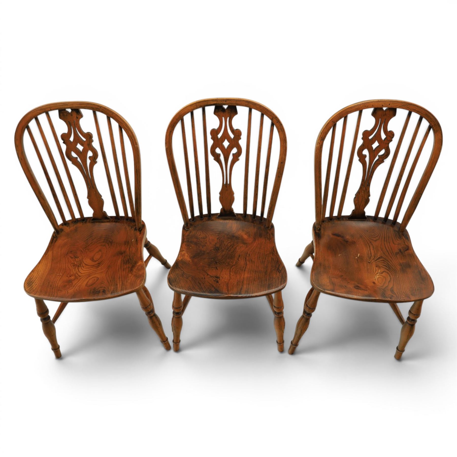 Set of six elm Windsor chairs, saddle seats with crinoline stretchers