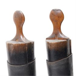 Two pairs of leather riding boots with wooden trees