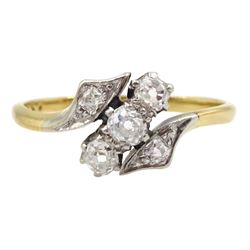 Early 20th century gold three stone old cut diamond crossover ring with diamond set shoulders, stamped 18ct Pt