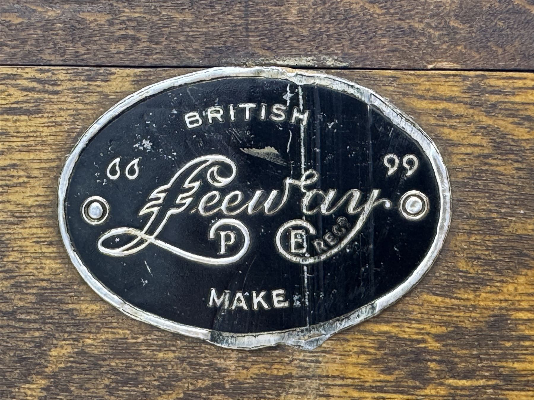 Leeway - late 19th century light oak child's roll-top desk, tambour top opening to reveal fitted interior with green felt writing surface and five pigeonholes, over three graduated drawers on the right side, raised on panelled side supports