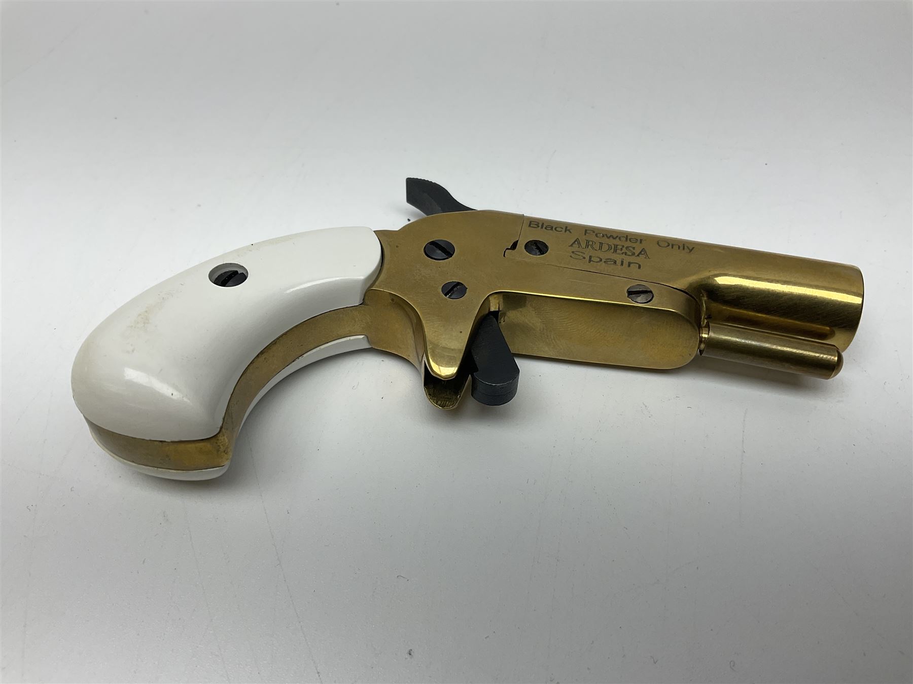 SECTION 1 FIRE-ARMS CERTIFICATE REQUIRED - Spanish Ardesa percussion vest pocket Derringer pistol, .31 cal. black powder; single shot; 6cm barrel; all brass body with white grips; no.14-13-013682-10 with Spanish certificate dated 2010 and box of one hundred balls