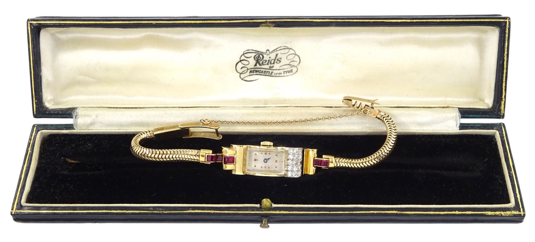 9ct gold calibre cut ruby and single cut diamond manual wind watch, case makers mark DS & S (possibly David Sutton & Sons), London 1946 on 9ct gold strap, in fitted velvet and silk lined case by Reids of Newcastle