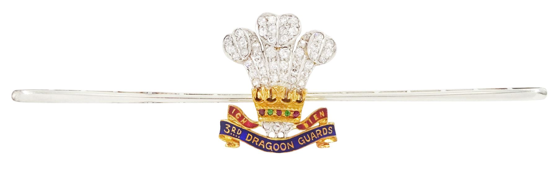 Early 20th century gold and palladium 3rd Dragoon Guards, multi gemstone set brooch, the Prince of Wales crest set with old cut and rose cut diamond ostrich feathers, garnet and ruby coronet and enamelled logo, in silk and velvet lined case by Harrods of London 