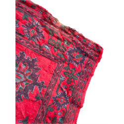 Early 20th century Western Anatolia Turkish Oushak crimson ground carpet, decorated with large Palmettes with trailing branches, the main border decorated with repeating stylised motifs within guard stripes 