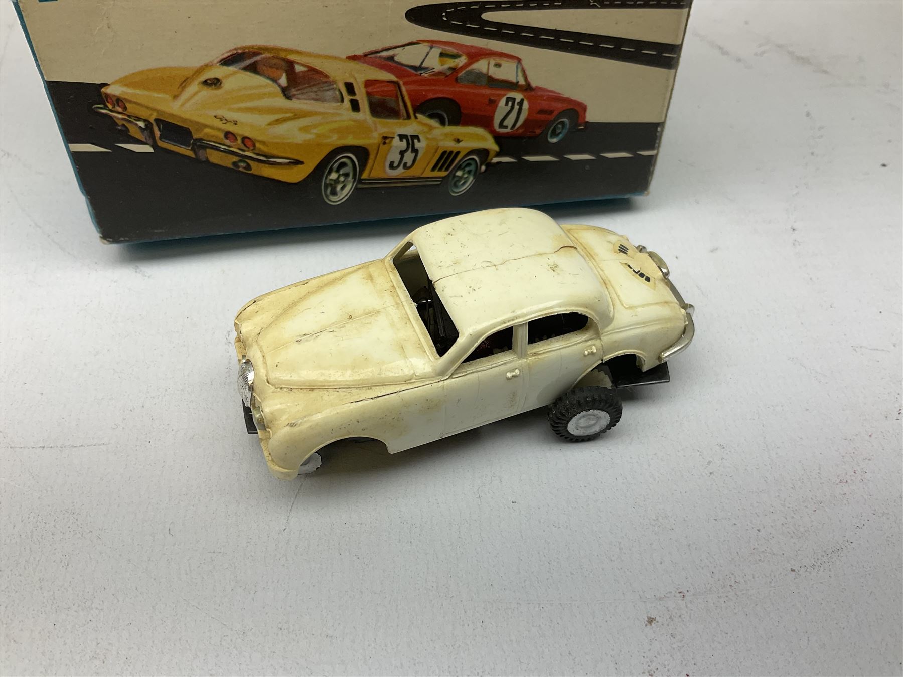 Various makers - Tri-ang Mini-Hi-Way Racing Car Series Le Mans No.9 racing car; Matchbox K-15 Merryweather Fire-Engine; Marx tin-plate Friction Helicopter; all boxed; and a Minic Motor Rally Adventure box containing a Jaguar Police car for spares or repair (4)