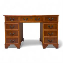 Contemporary yew wood twin pedestal desk, rectangular top inset with gilt tooled green lea...