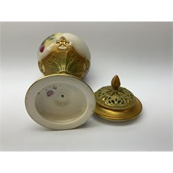 A Royal Worcester potpourri vase and cover, shape 1813, the bulbous body hand painted with pink roses and signed A Watkins, supporting a gilded and burnished pierced cover, upon a moulded stem with zoomorphic mask detail and circular foot, with puce printed mark beneath, H24cm
