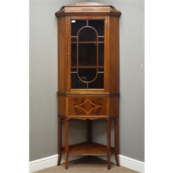  Edwardian mahogany corner display cabinet, satinwood banded pediment above astragal glazed door and single cupboard with figured inlay, tapering supports with undertier, paper label underneath 'Liberty & Co', W76cm, H185cm  