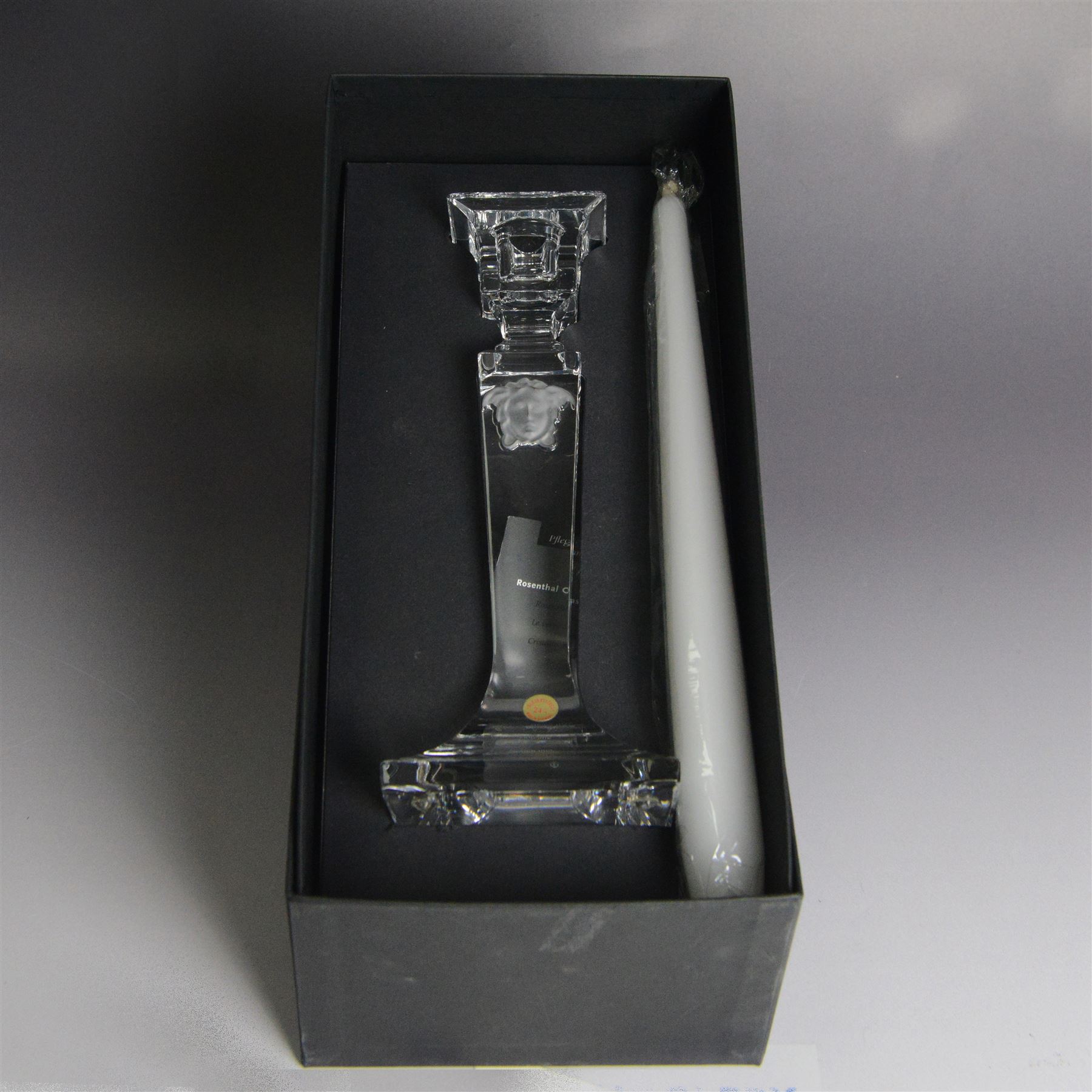 Rosenthal Versace pair of glass candlesticks, of square form, with candles and in original box, H25cm