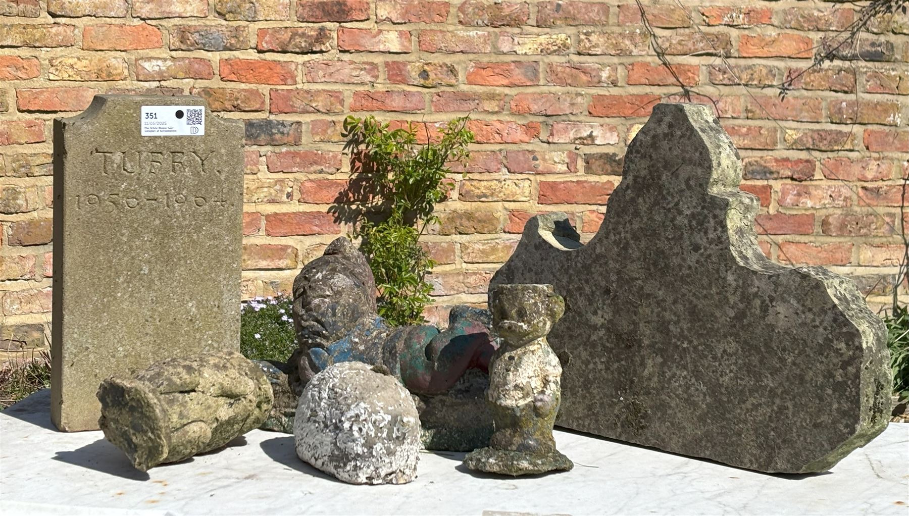 Group of carved stone garden ornaments, together with a inscribed 