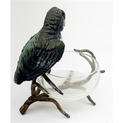 A cold painted model of a Kingfisher surmounted upon a branch surporting a small clear glass bowl, H10.5cm, together with a small bronze model of a penguin, stamped EWB, H7cm. 