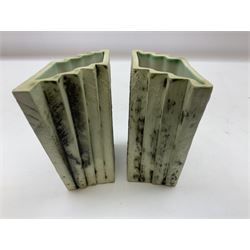 Pair of Carn Pottery Penzance vases of fan form, with tube lined floral and stylised decoration, stamped and marked X9 to base, H11.5cm