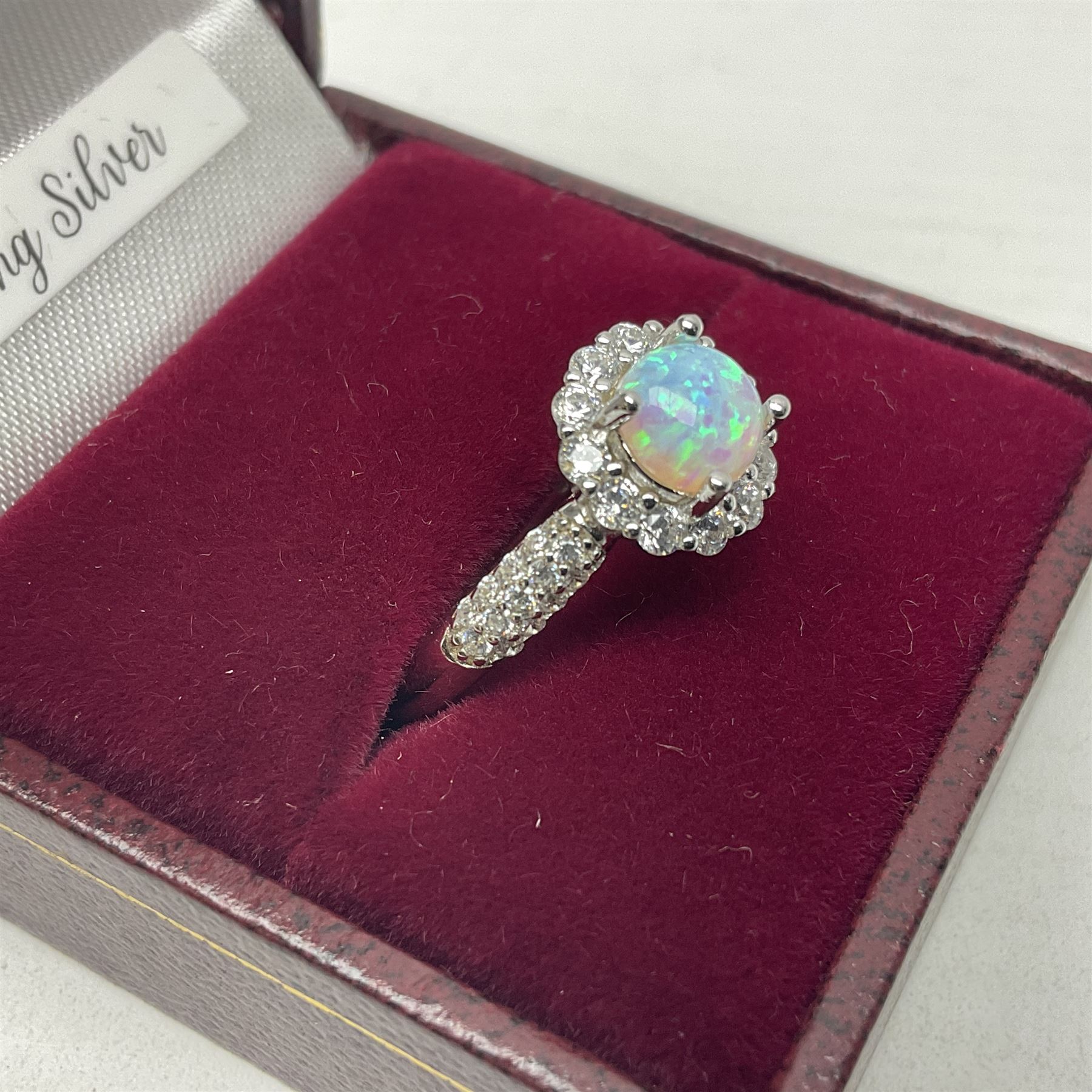 Silver opal and cubic zirconia cluster ring, stamped 925, boxed