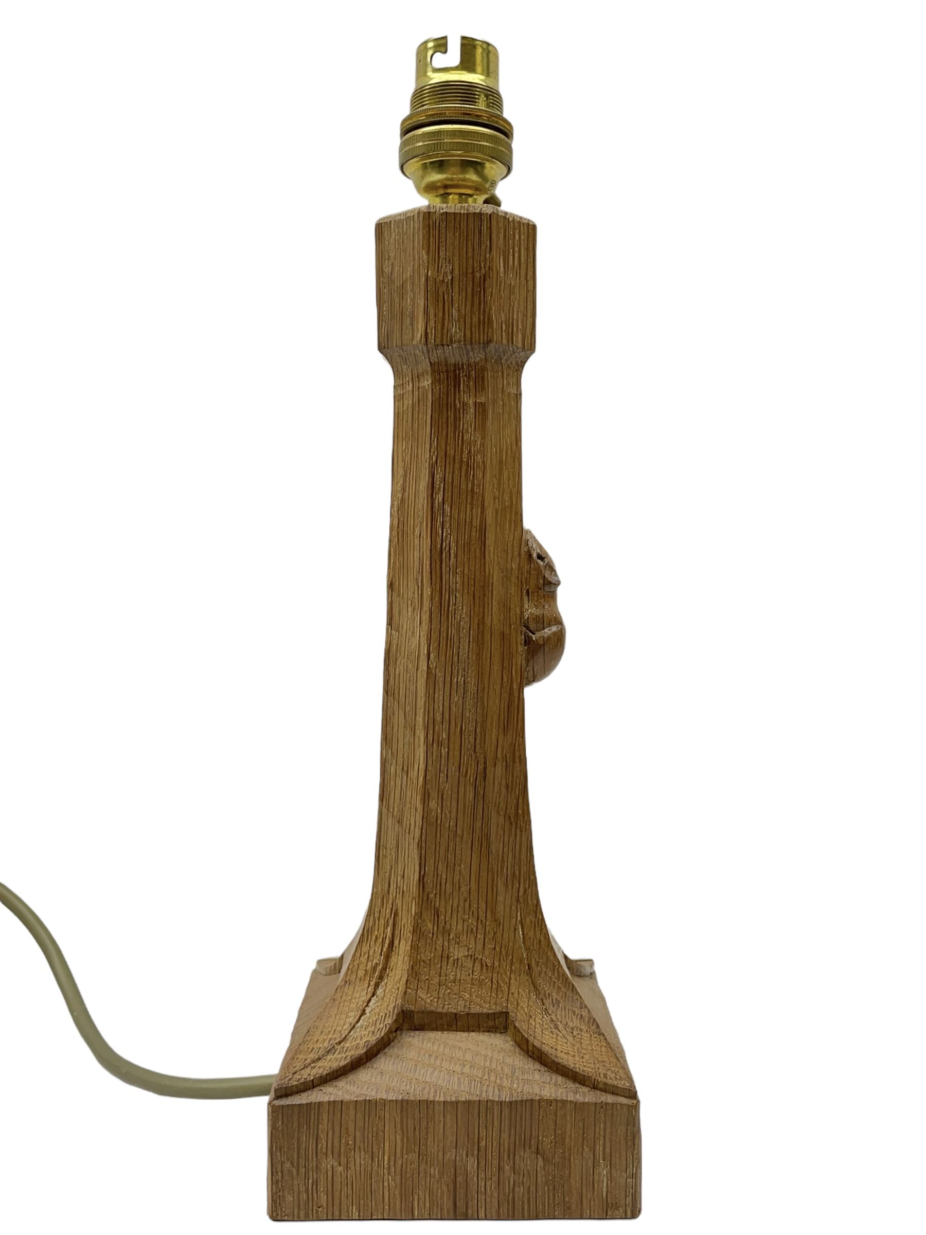 'Mouseman' tooled oak table lamp with tapered octagonal stem on leaf