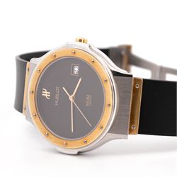 Hublot MDM Classic gentleman's 18ct gold and stainless steel quartz wristwatch, Ref. 1523.2, black dial with date aperture, on rubber strap with fold-over clasp, boxed with guarantee card dated 2004