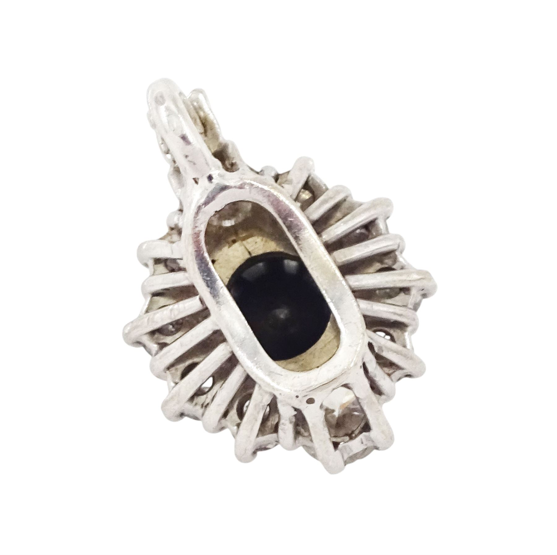 18ct white gold diamond pendant, single round brilliant cut black diamond of approx 0.90 carat, surrounded by ten round brilliant cut white diamonds, the bail set with a further diamond, total white diamond weight approx 0.80 carat