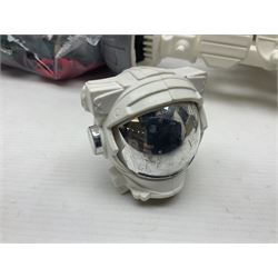 Action Man - large collection of 1960s and later figures and accessories including Spaceman with ATLRV vehicle; two figures marked 'Made in England by Palitoy under licence from Hasbro 1964'; twenty-five assorted weapons; radio backpacks; kit bags; twenty-one pairs of boots; football boots and snow shoes; metal diver's boots and three pairs of flippers; two pairs of jackboots; roller skates; various tunics, trousers, flying suits, jumpers, belts etc; twenty helmets, berets, busby, kepis, submariner etc; and quantity of other accessories