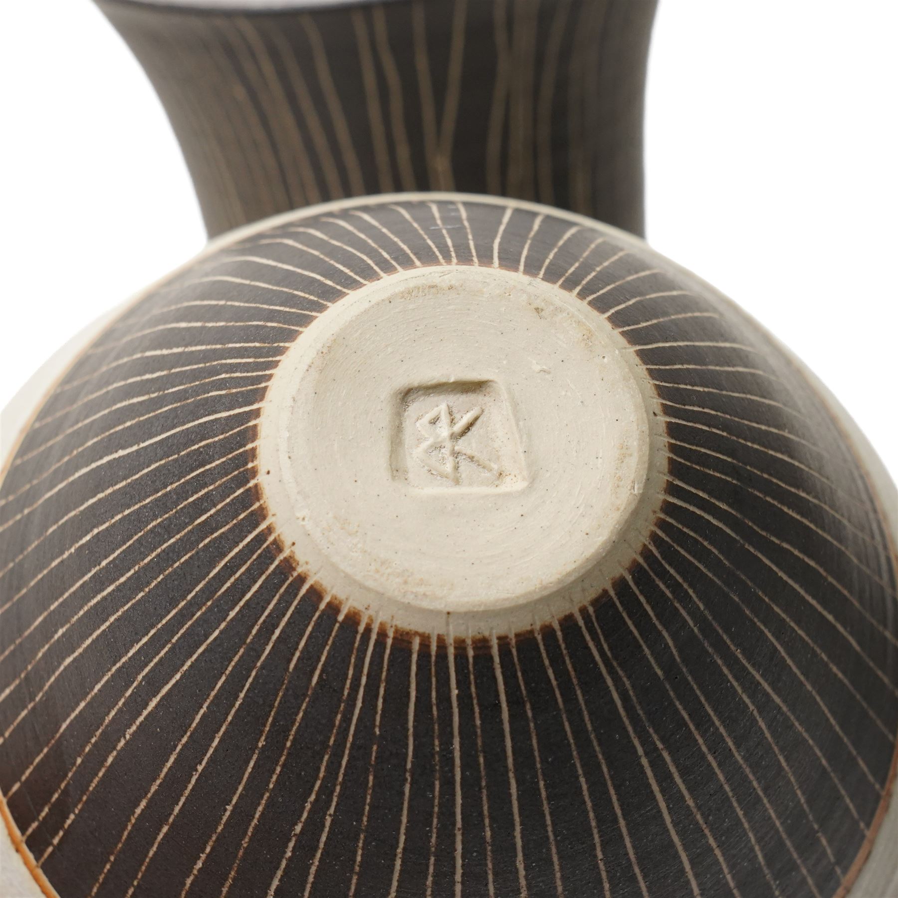 Sarah Butler and Martin Clark: Two works, comprising a sleeve vase and one bowl, each with vertical sgraffito decoration, and with incised potters marks to base, largest H19.5cm (2)