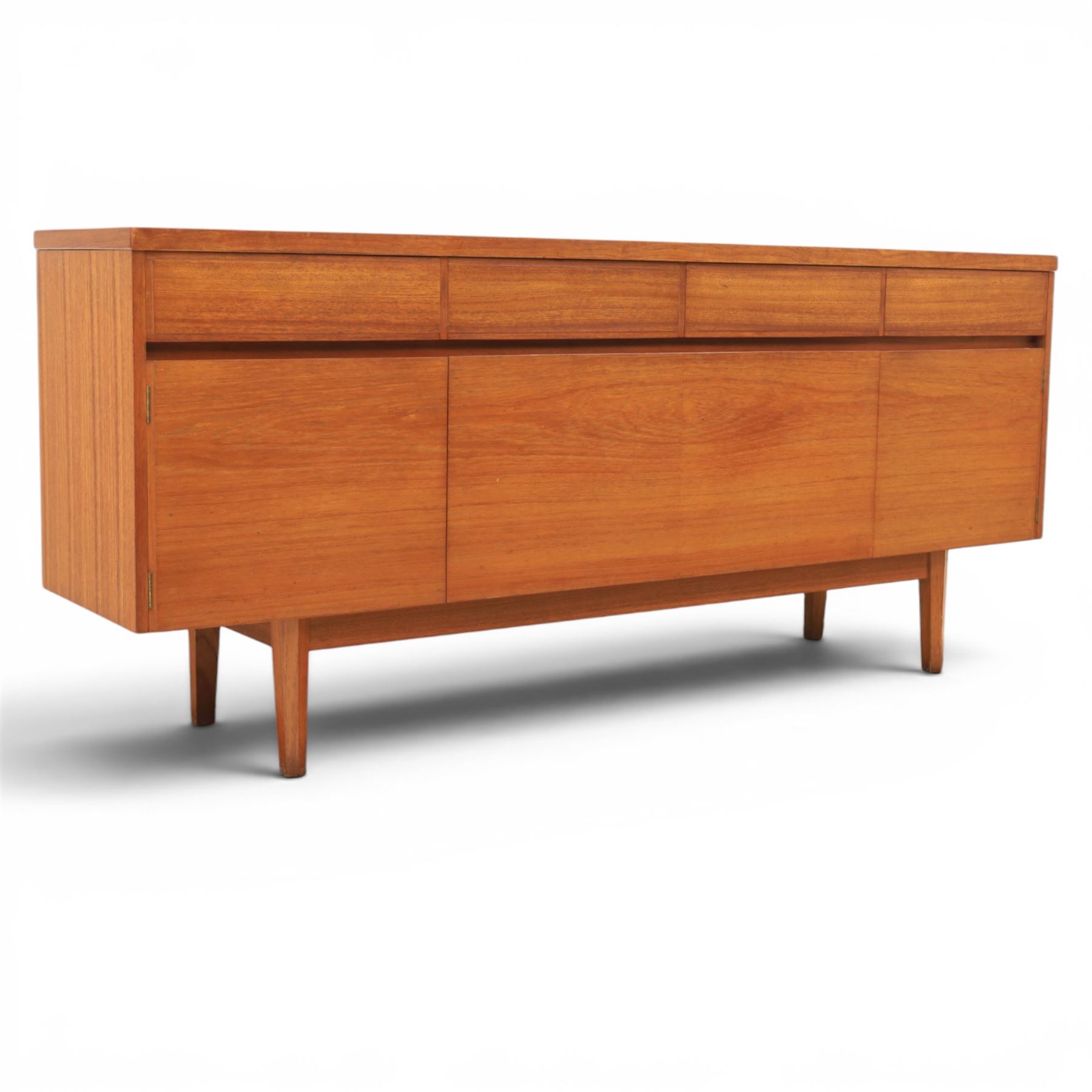 Mid-20th century teak sideboard, rectangular top above four frieze drawers with recessed handles, flanked by two cupboard doors with fall front central media cupboard