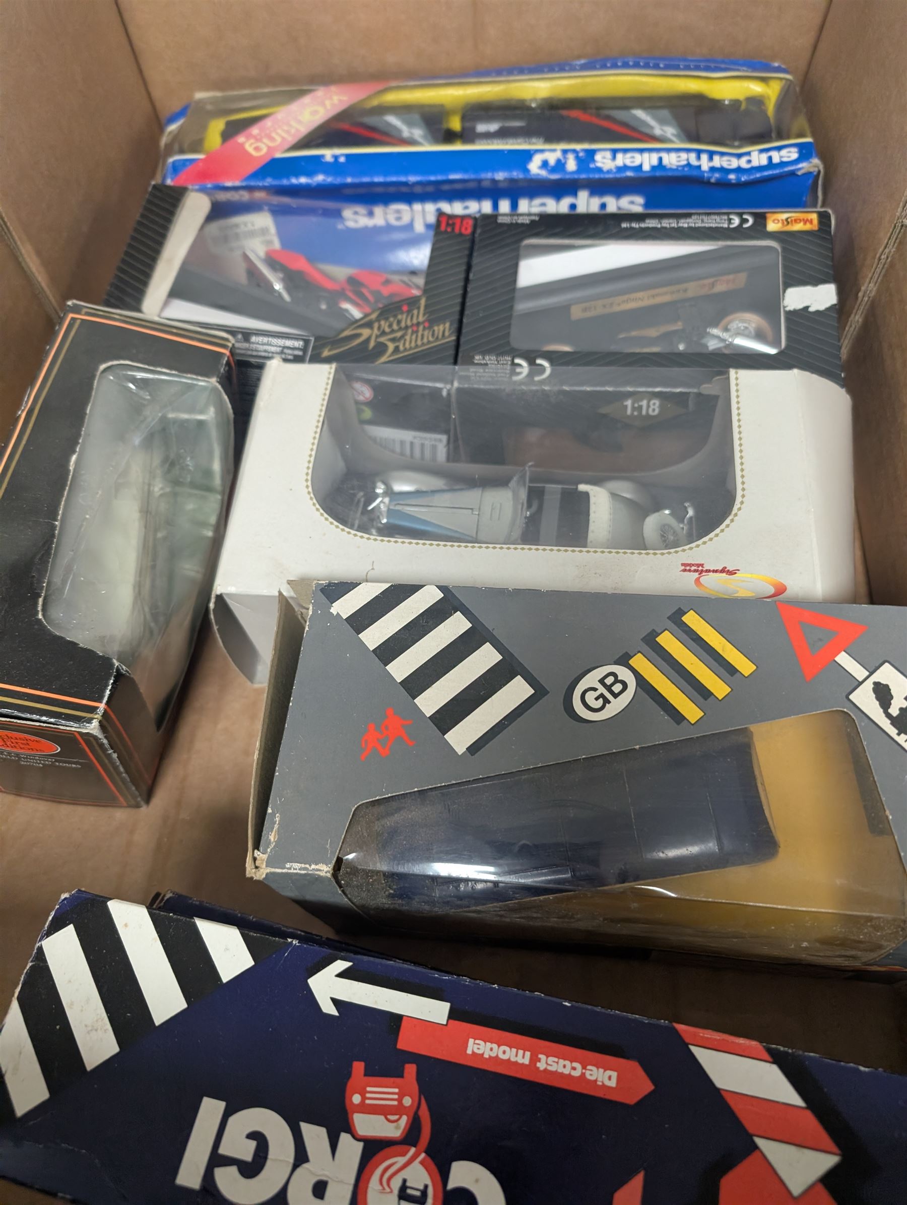 Collection of diecast model vehicles, including Corgi Super Haulers Pickfords lorry, Corgi Bedford Coach, Lledo Days Gone and Trackside models two Maisto motorcycles, etc, all boxed together with a St Johns tinplate Land Speed Record clockwork car