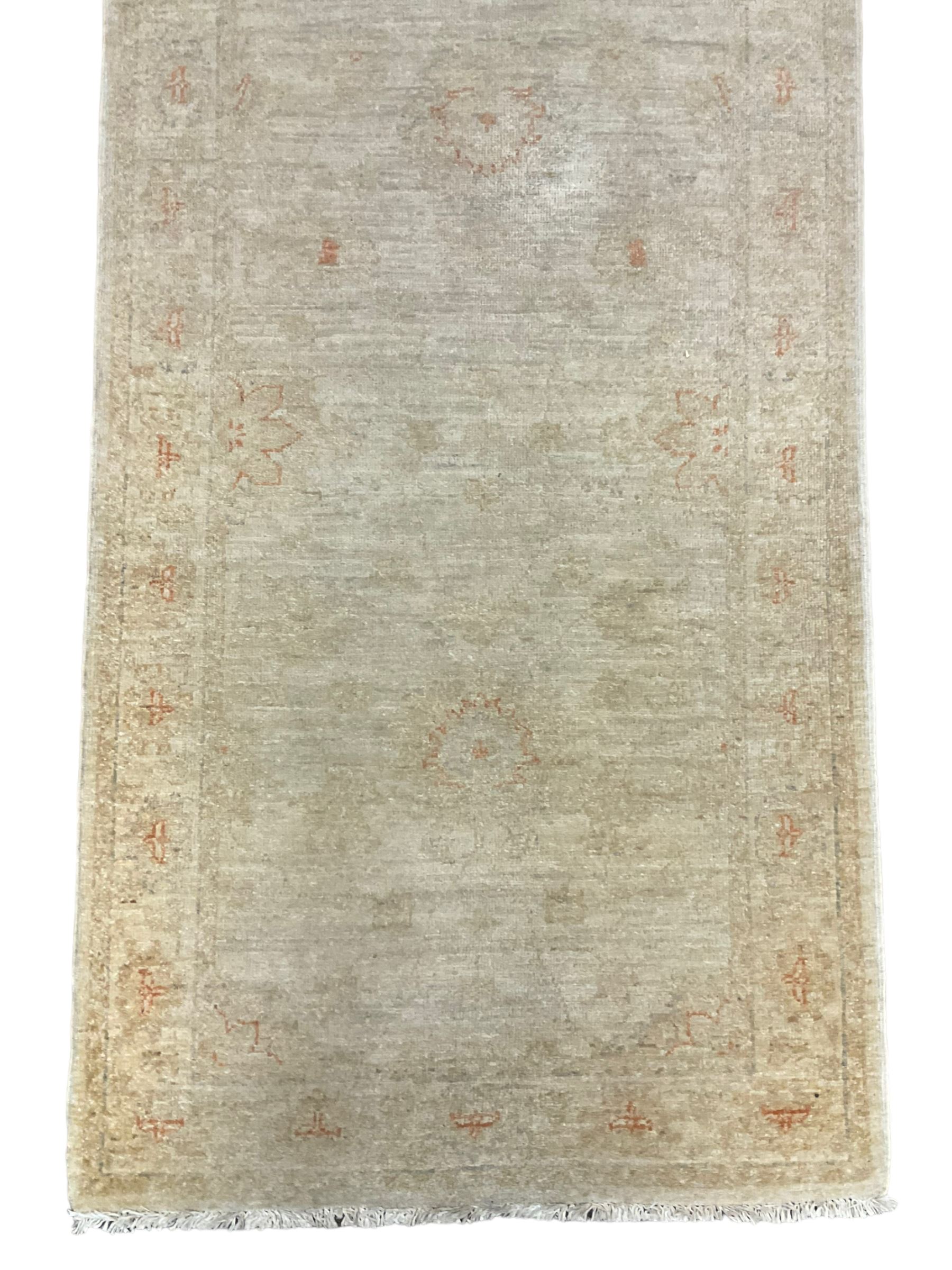 Persian Zeigler runner, ivory ground decorated with faint floral design 