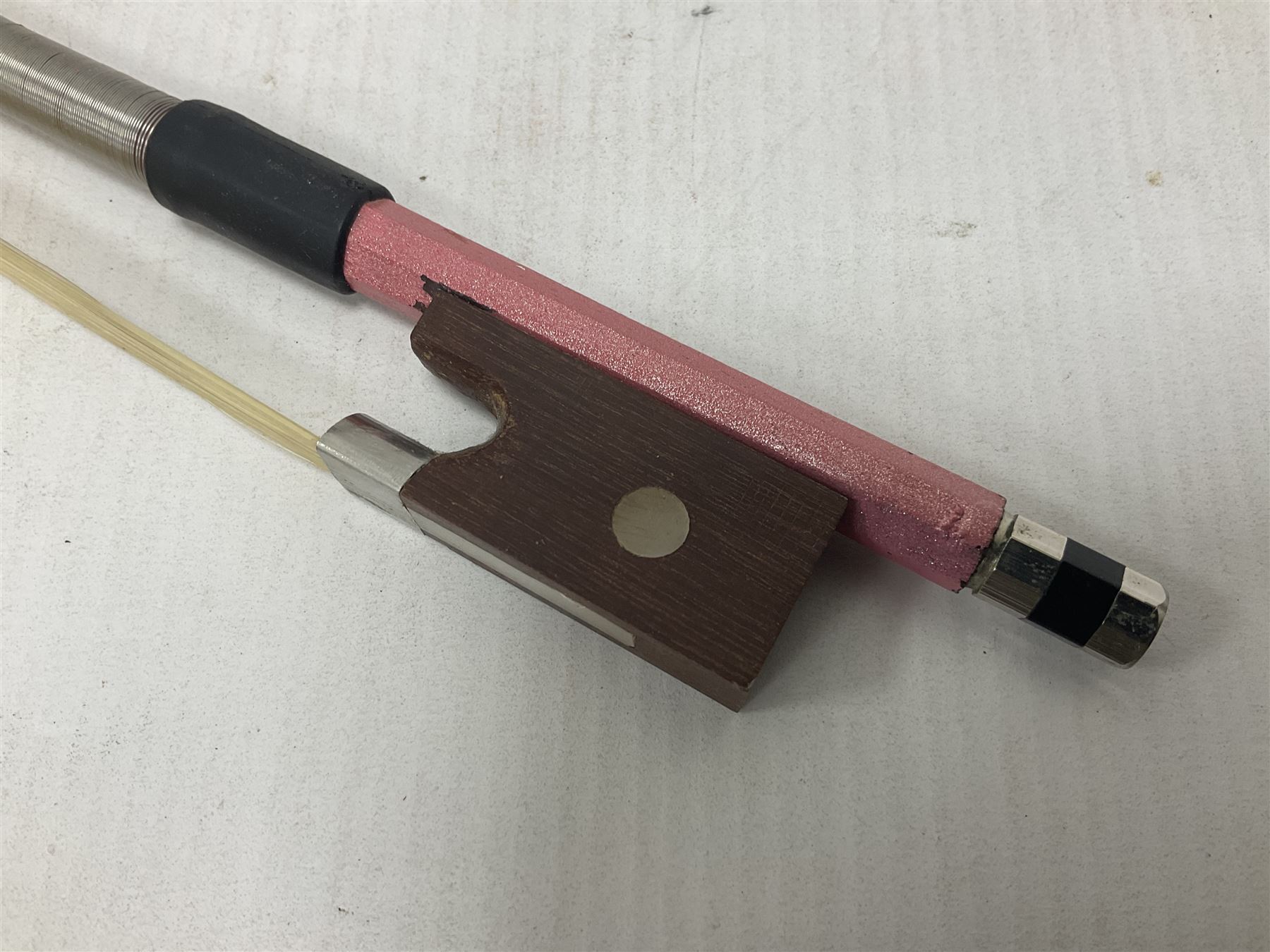 Zest full size pink violin, with a solid wood body and maple head, with matching pink bow and two further bows, in a hard case Length 60cm