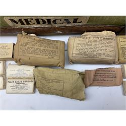 WW2 British Army RAMC 'Regimental Medical Pannier', well marked externally and dated 1941, stamped May 1943 internally, canvas covered wicker form with leather edges, hinged top and fall front with two rope carrying handles, fitted iron locking straps with securing chains; contains various unused field dressings and bandages with WW2 dates and two pillows; original label under lid L79cm