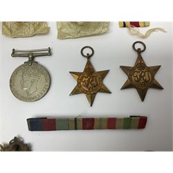 WWII group of three medals comprising 1939-45 War Medal and Italy and Africa Stars in issue box; dog tags for 282894 W. Wilkinson with framed photograph in uniform; and small quantity of cloth and metal badges including RAOC cap badge