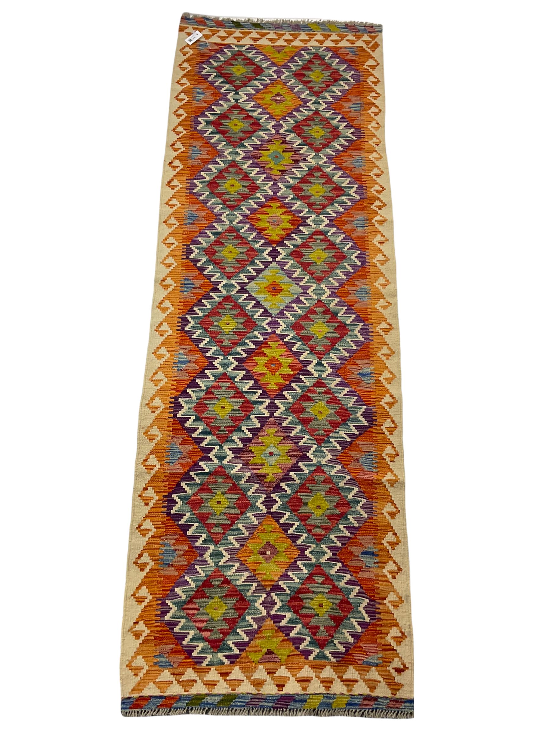 Chobi kilm runner, multi-colour ground, repeating stepped lozenge design