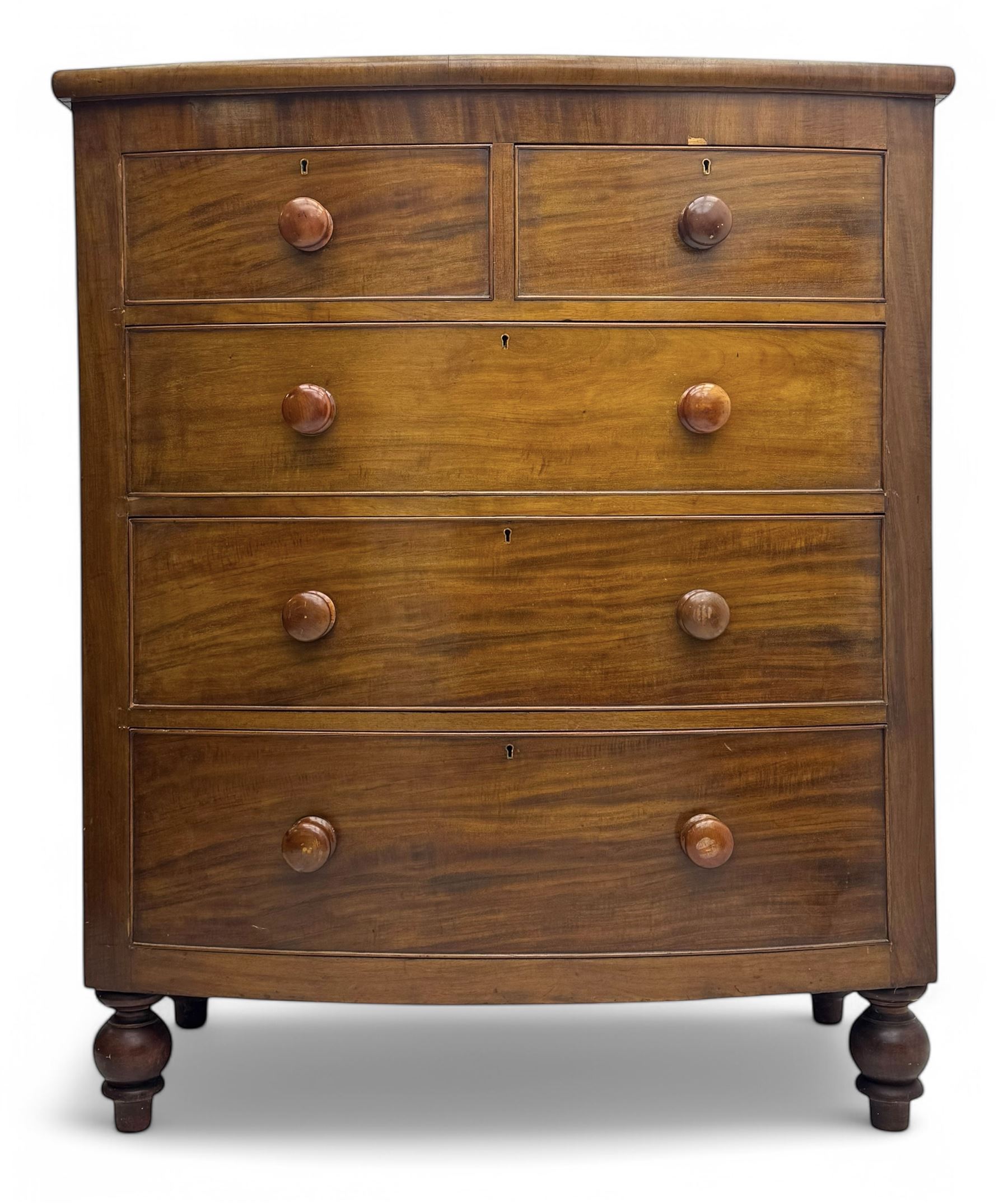 Victorian mahogany bow-fronted chest, fitted with two short over three long graduated cockbeaded drawers, on turned bun supports