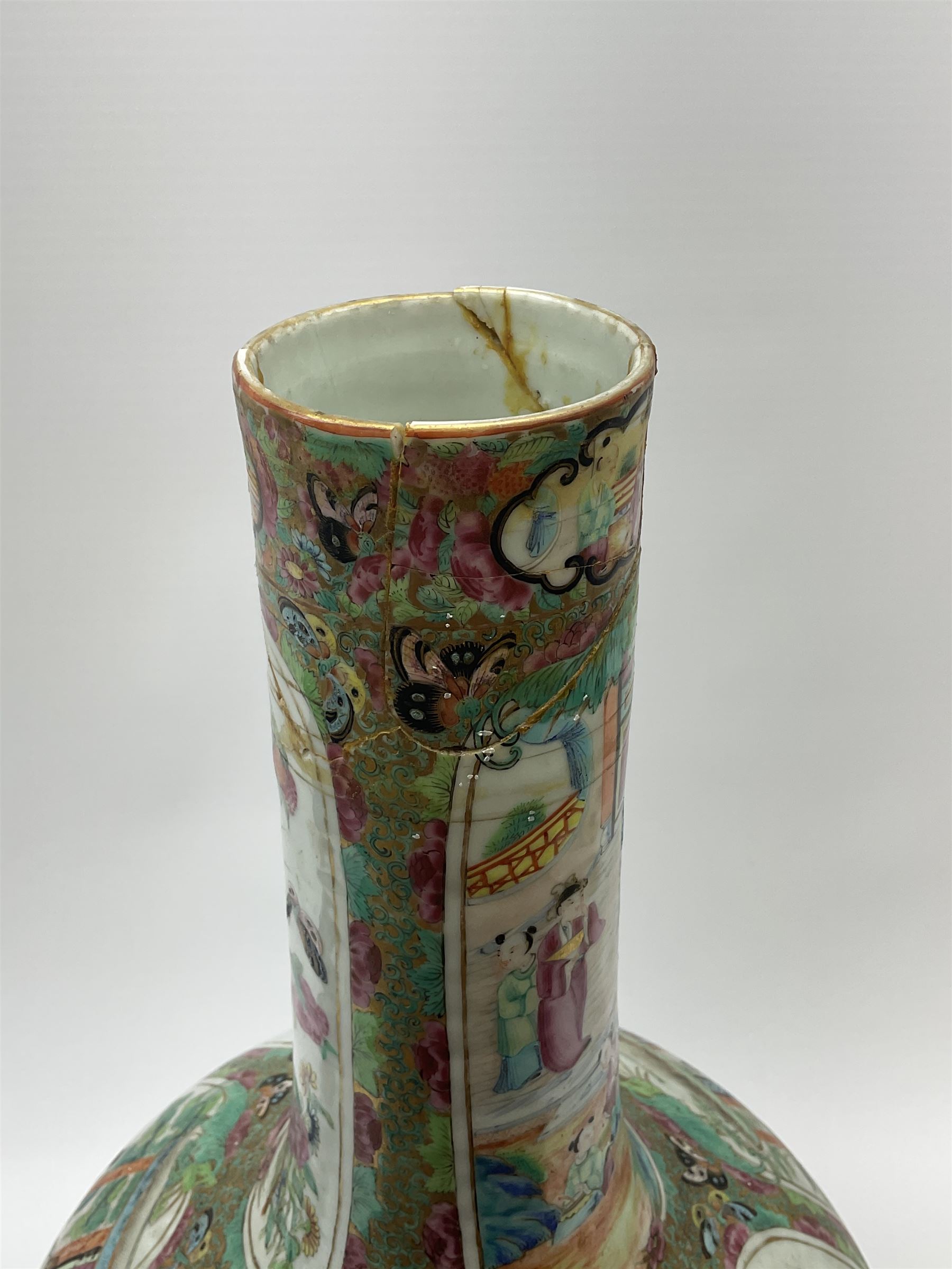 A 19th century Chinese Canton Famille Rose vase, of globular form with tall neck, and cover with finial, decorated with alternating panels of figural scenes, and birds and butterflies amongst blossoming and fruiting trees, with foliate surround against gilt, overall H57cm. 