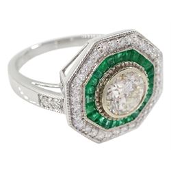18ct white gold round brilliant cut diamond and calibre cut emerald hexagonal ring, stamped 18K, central diamond 1.02 carat, with World Gemological Institute report