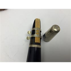 Early 20th century Hawkes and Son simple system hardwood clarinet serial no.1HM257102; cased; and a Swiss Maelzel BS Dulcet metronome of typical pyramid form (2)