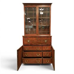 Early 19th century mahogany secretaire-bookcase, projecting cornice above astragal glazed cabinet with adjustable shelved interior, fall front secretaire drawer, fitted interior with pigeonholes and drawers, flame mahogany fronted cabinet with three drawers, on turned supports 