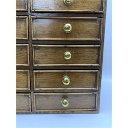 18th century oak chest of small proportions, with single long drawer over ten small drawers with brass knop handles, H49 L46 D23