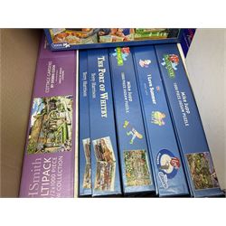 Large collection of jigsaw puzzles and games, to include examples from Gibsons, in four boxes 