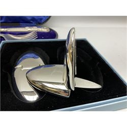 Cased pair of Wedgwood silver-plate book stands, silver-plate baby feeding spoon and pusher in box, other silver-plated cutlery