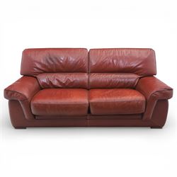 Fabrizio Mantellassi - 20th century Italian red leather suite, one three seat and two large armchairs, upholstered in deep red hide with stitched seam detailing, with magazine pockets to each side, the rectangular back cushions above broad padded arms and seat cushions, raised on low block bases

Sofa: H c98m, W 203cm, D 92cm
Armchair: H 98cm, W 113cm, D 92cm